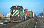 Burlington Northern, BN SD40-2 7183 leads a eastbound at, Rochelle, Illinois. December 9, 1998. Jack D Kuiphoff © photo